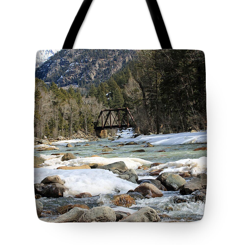 River Tote Bag featuring the photograph Distant Bridge by Mary Haber