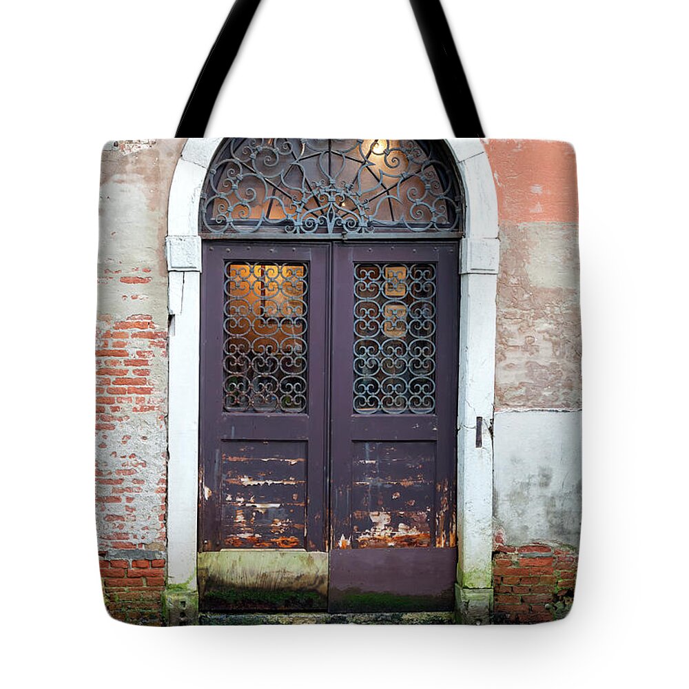 Saturated Color Tote Bag featuring the photograph Door To The Canal In Venice by Nikkosdaskalakis