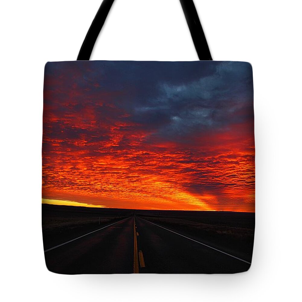 Dramatic Sunrise Tote Bag featuring the photograph Dramatic sunrise by Lynn Hopwood