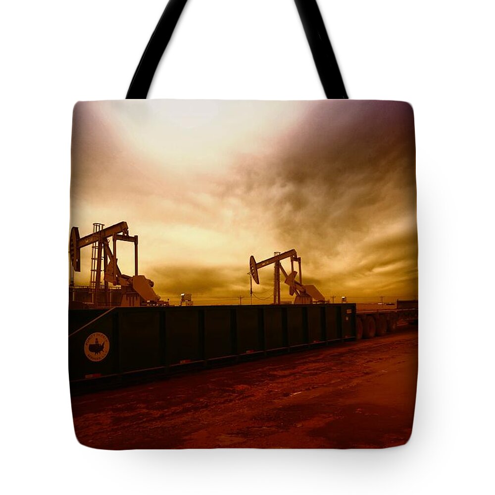 Oil Tote Bag featuring the photograph Dropping A Tank by Jeff Swan