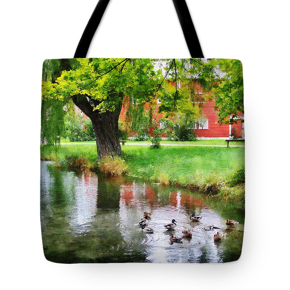 Ducks Tote Bag featuring the photograph Ducks on Pond by Susan Savad