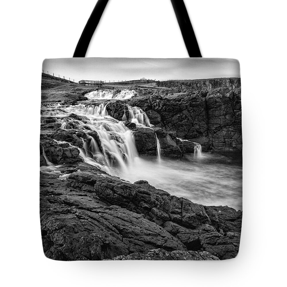 Dunseverick Tote Bag featuring the photograph Dunseverick Waterfall by Nigel R Bell
