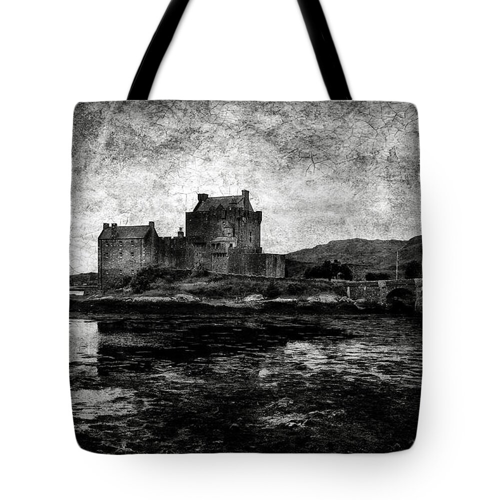 Eilean Tote Bag featuring the photograph Eilean Donan castle in Scotland BW by RicardMN Photography