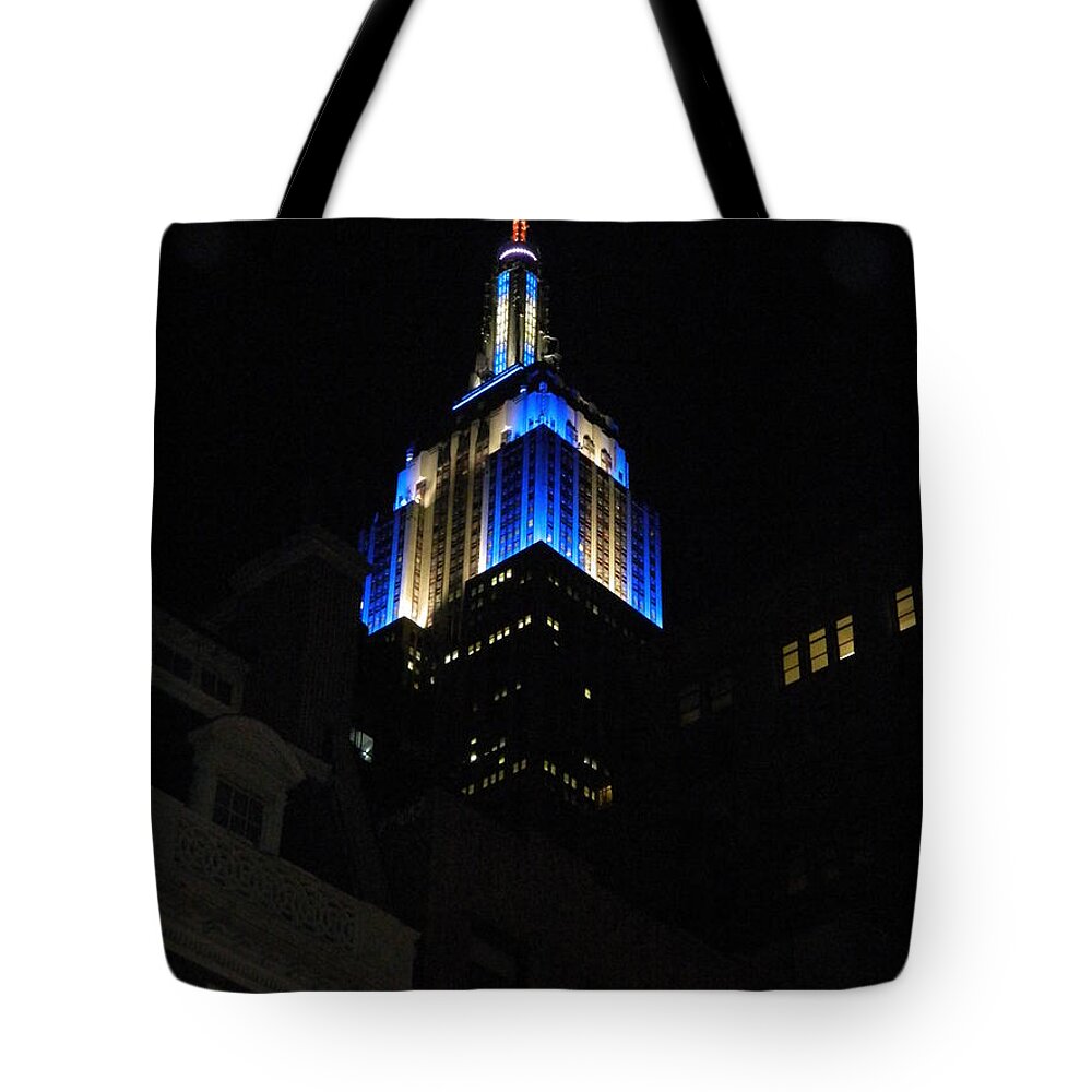 Empire State Building At Night Tote Bag featuring the photograph Empire State Building At Night by Emmy Vickers