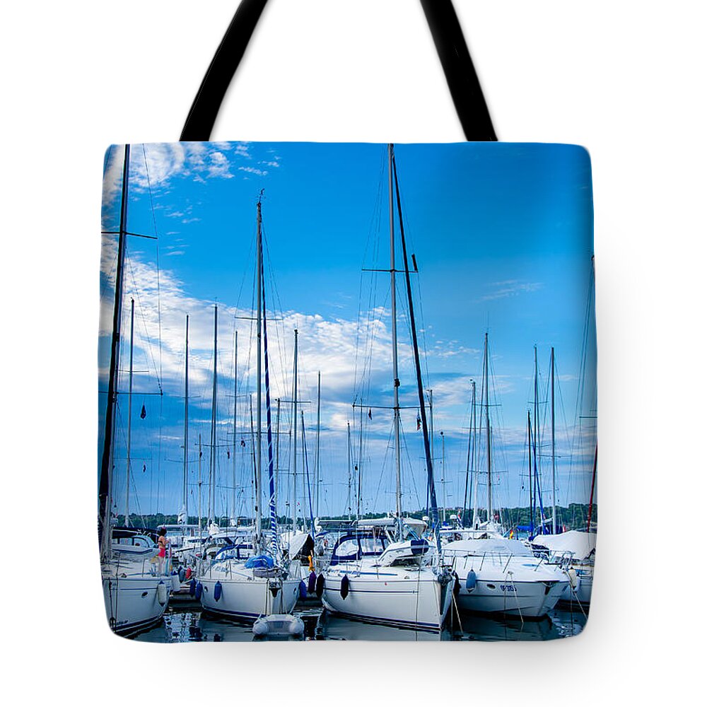 Boat Tote Bag featuring the photograph Evening harbour with sailboats by Andreas Berthold