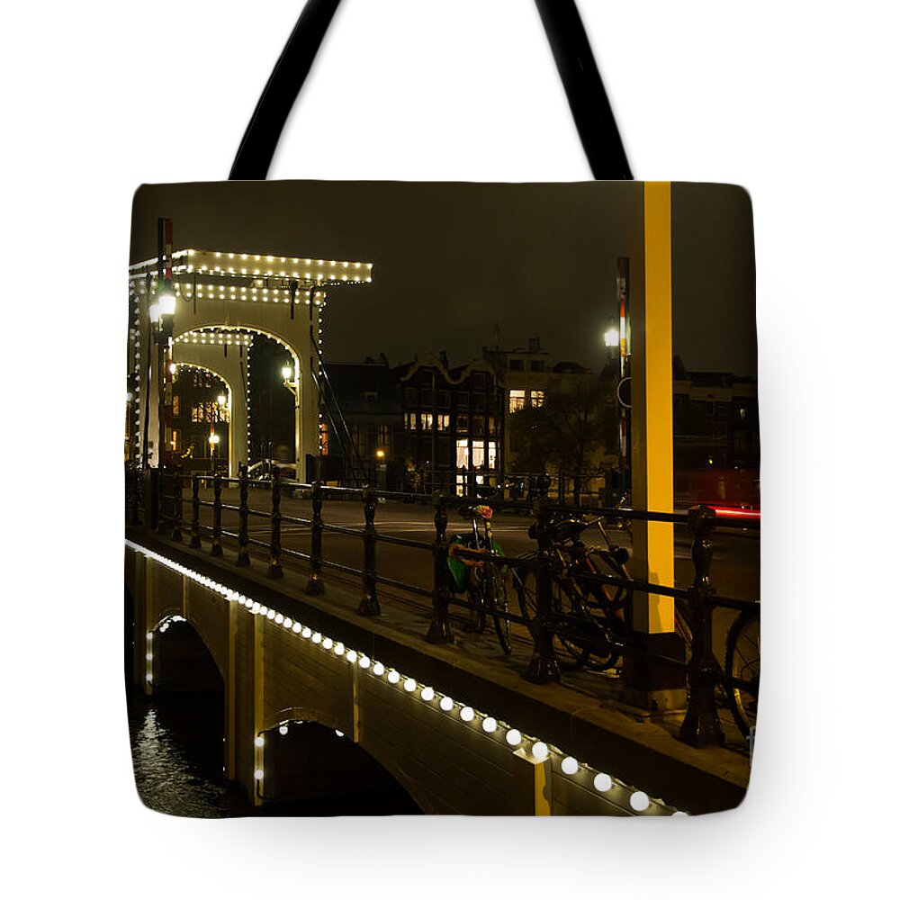 Amsterdam Tote Bag featuring the photograph Evening in Amsterdam by Agnes Caruso
