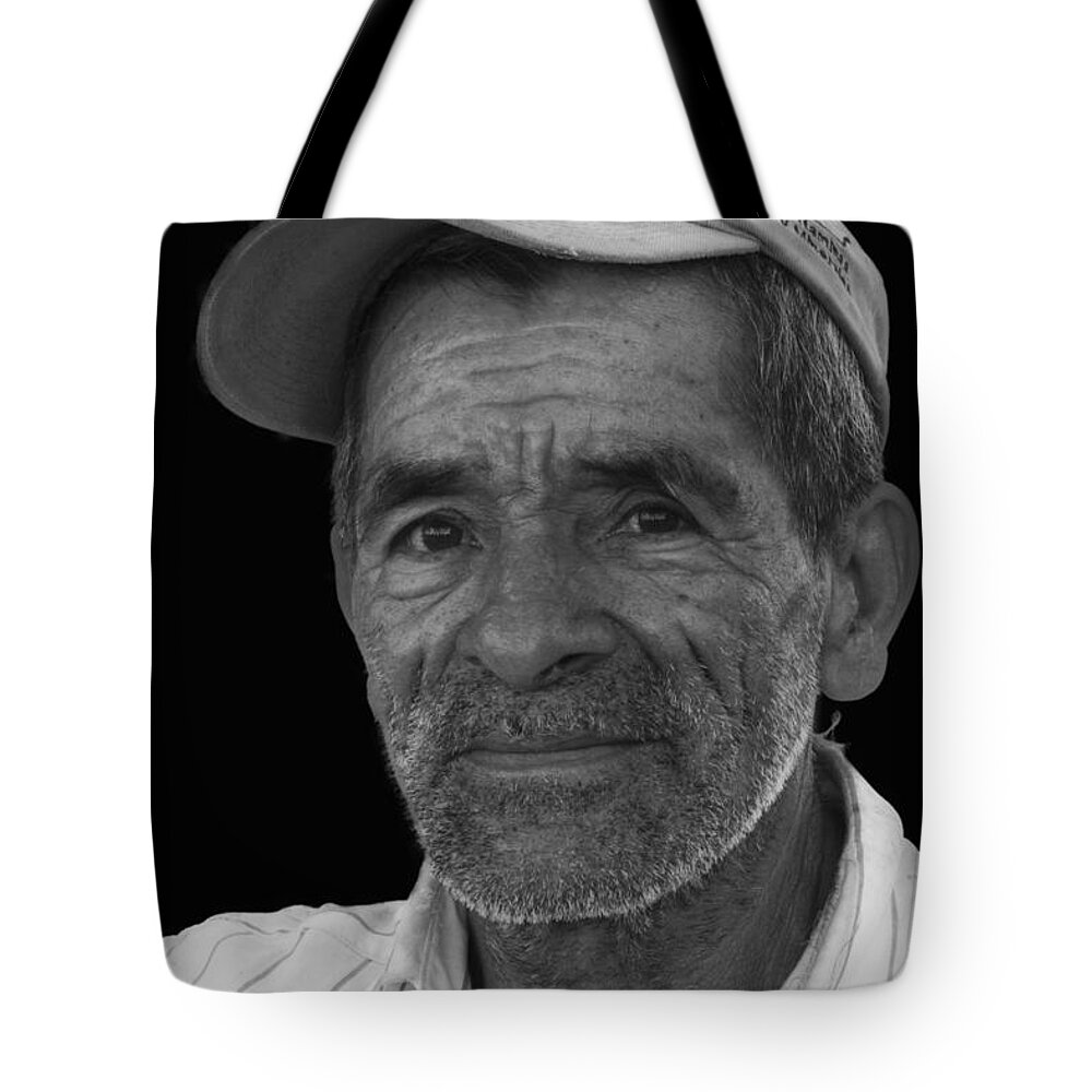 Heiko Tote Bag featuring the photograph Face of a Hardworking Man by Heiko Koehrer-Wagner