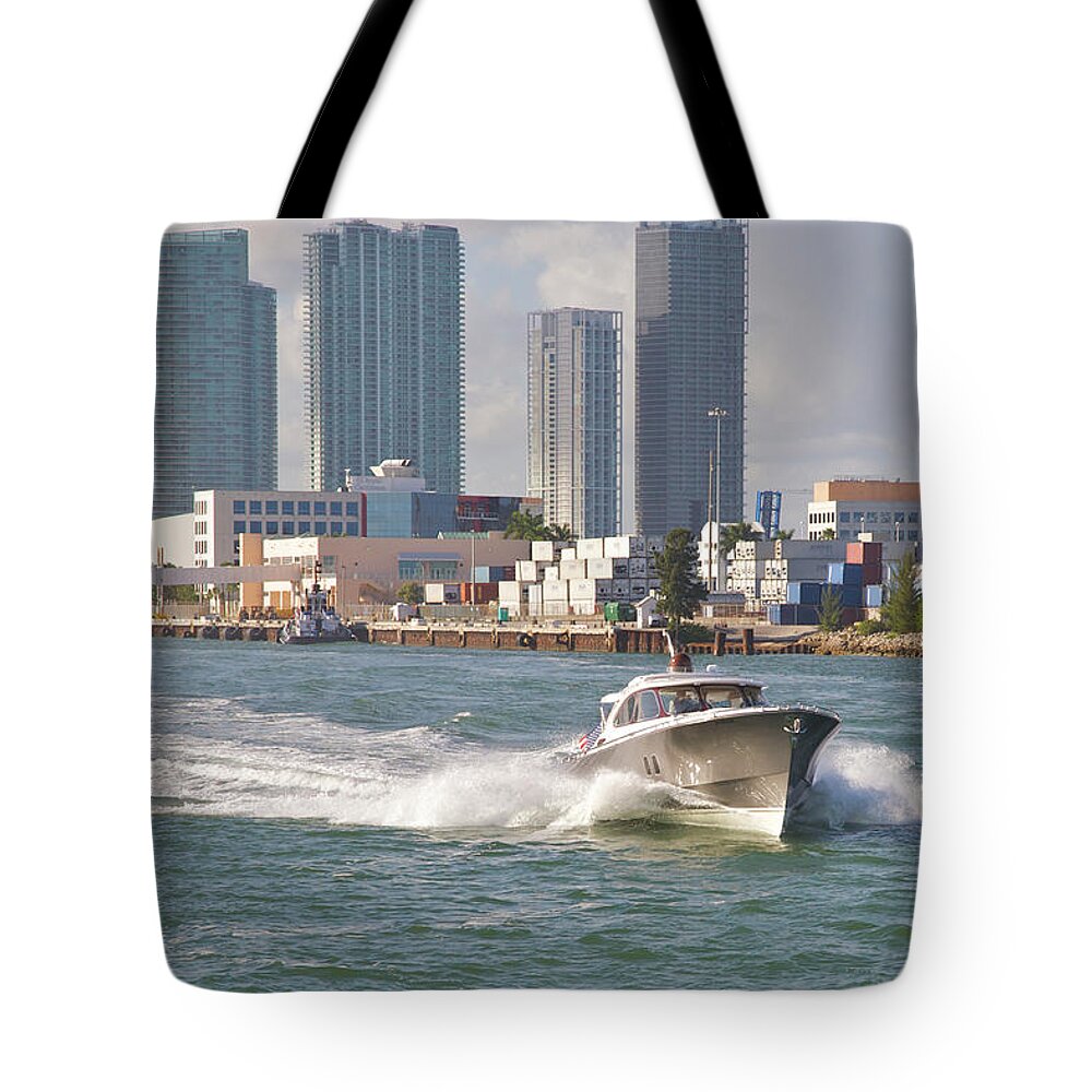 Wake Tote Bag featuring the photograph Fast-moving Pleasure Boat On City Waters by Barry Winiker