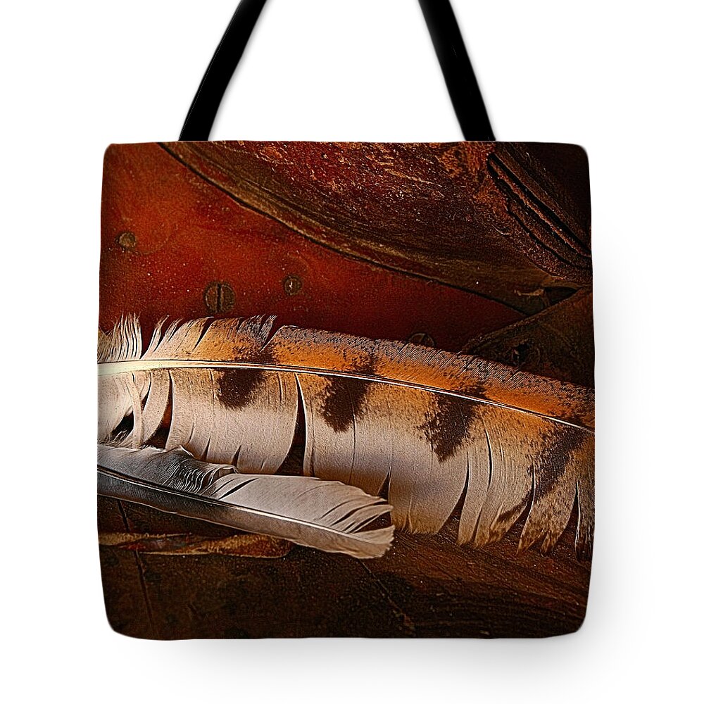 Still Life Tote Bag featuring the photograph Feather and Leather by Steven Reed