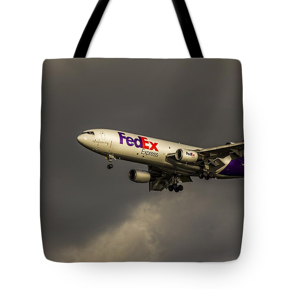 Jumbo Jets Tote Bag featuring the photograph FedEx 052 Heavy Cleared to Land by Marvin Spates