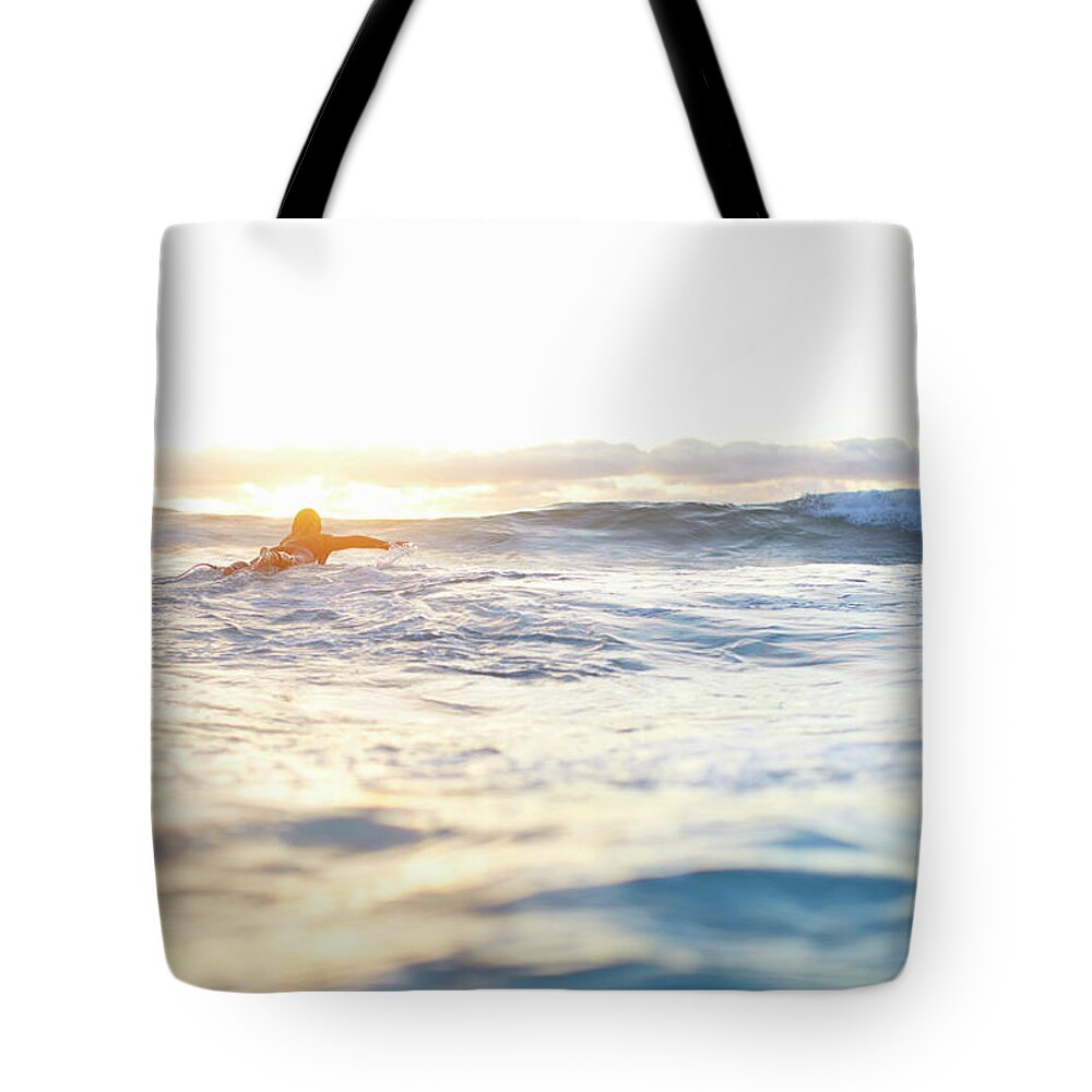 People Tote Bag featuring the photograph Female Surfer Swimming Out To Waves On by Moof
