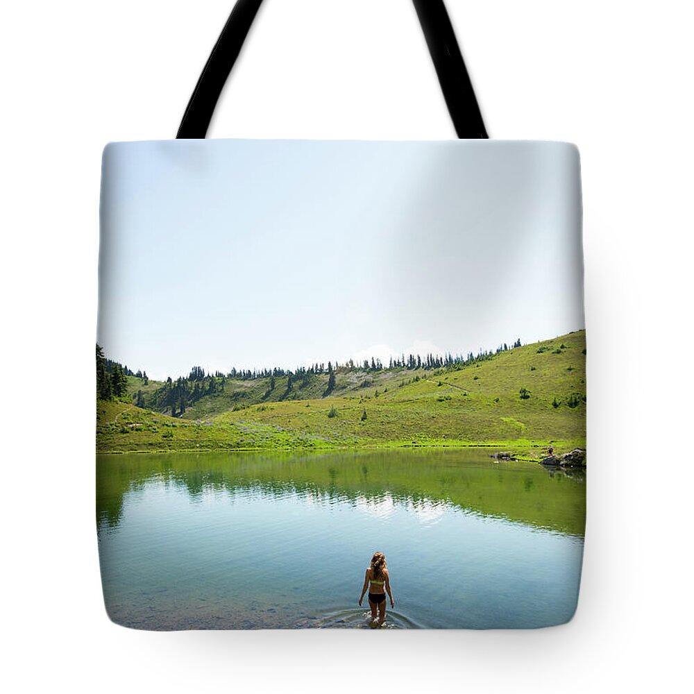 Tranquility Tote Bag featuring the photograph Female Swimming In A Lake by Jordan Siemens