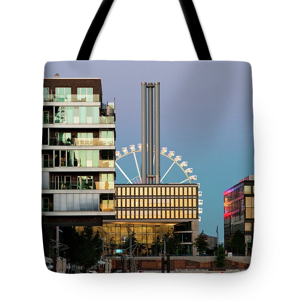 Built Structure Tote Bag featuring the photograph Ferris Wheel And New Buildings by Thomas Winz
