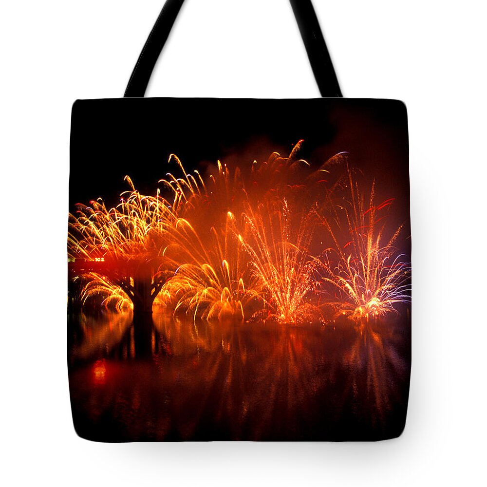Fireworks Tote Bag featuring the photograph Fire on the Water by Paul W Faust - Impressions of Light