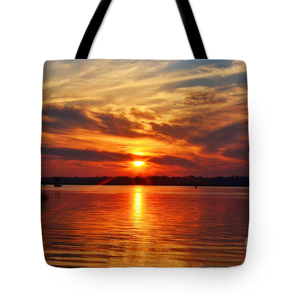 Sunset Tote Bag featuring the photograph Firey Sunset by Kathy Baccari