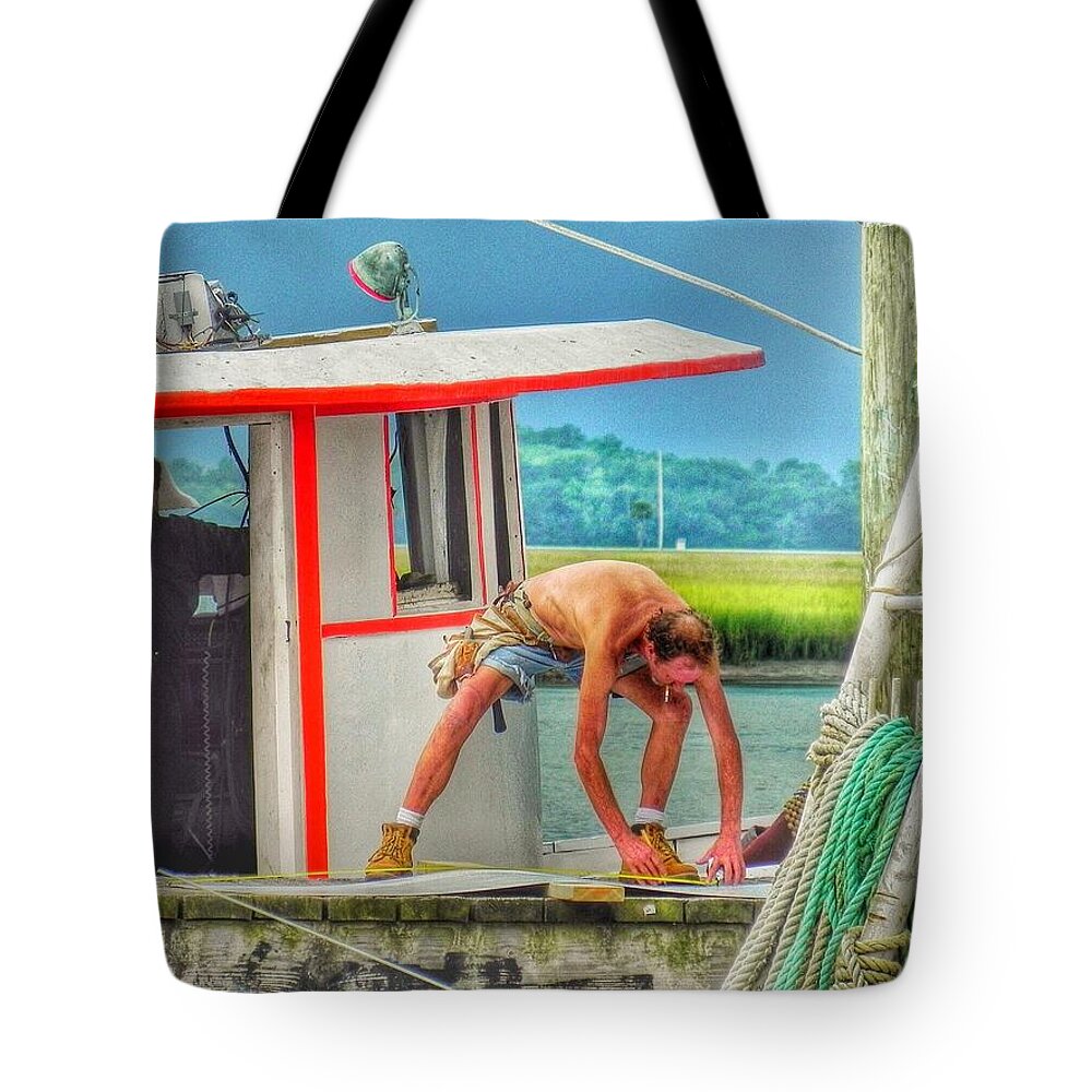 Fisherman Commercial Fishing Tote Bag featuring the photograph Fisherman Working on His Boat by Patricia Greer