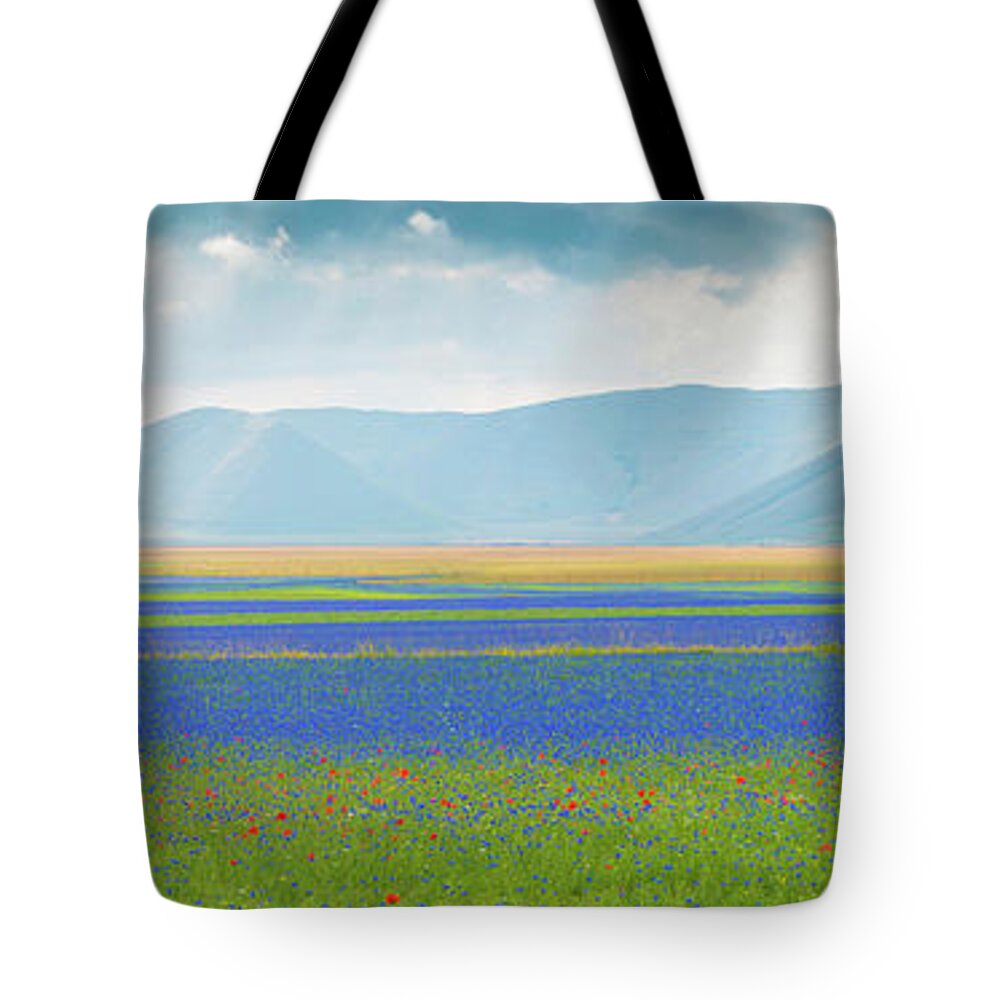 Photography Tote Bag featuring the photograph Flowering Plants With Mountain Range by Panoramic Images