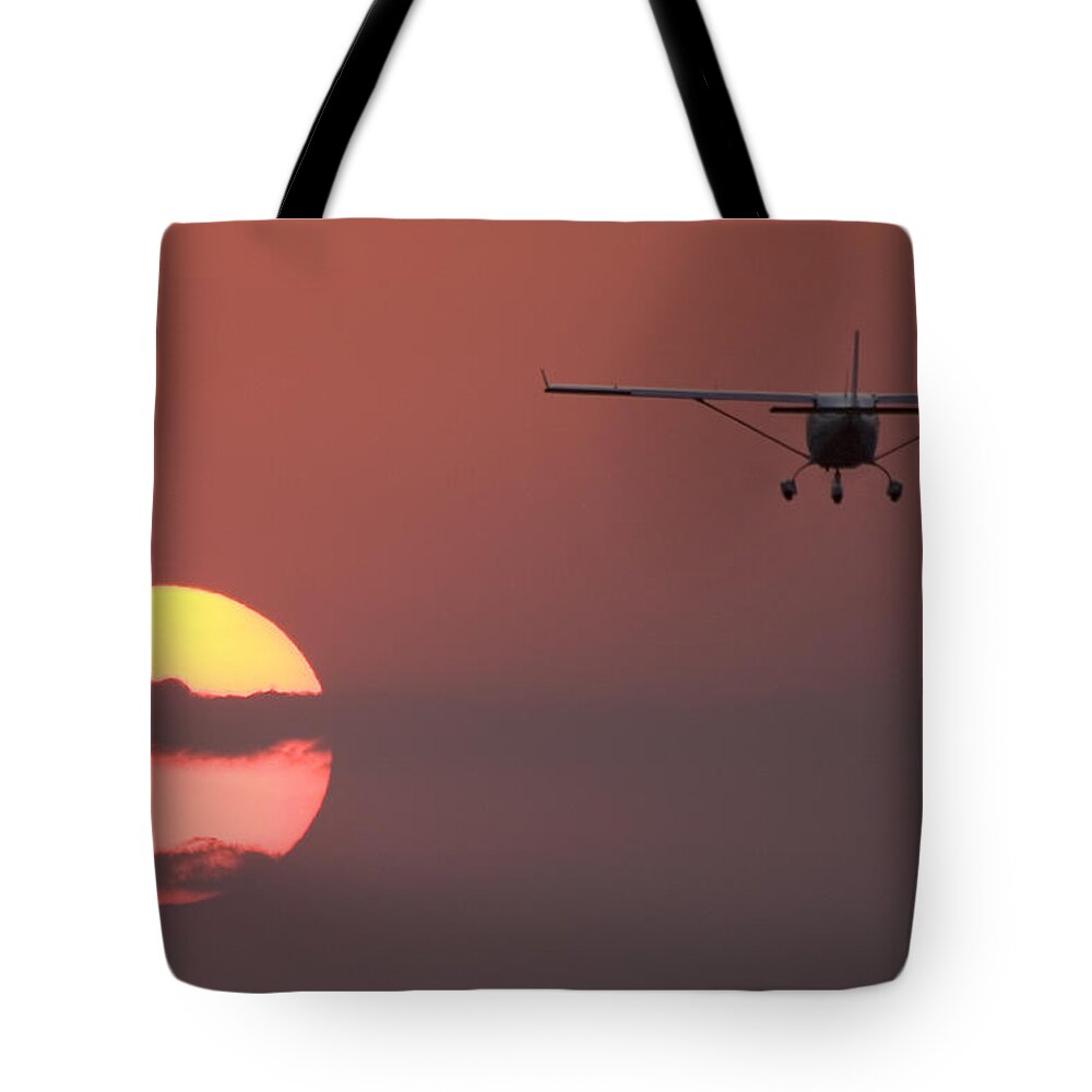 Jabiru Aircraft Pty Ltd Tote Bag featuring the photograph Flying into the Sun by Paul Job