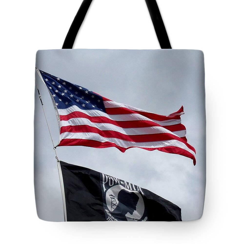 Flags Tote Bag featuring the photograph American Flag Flying Proudly Above All Others by Eunice Miller