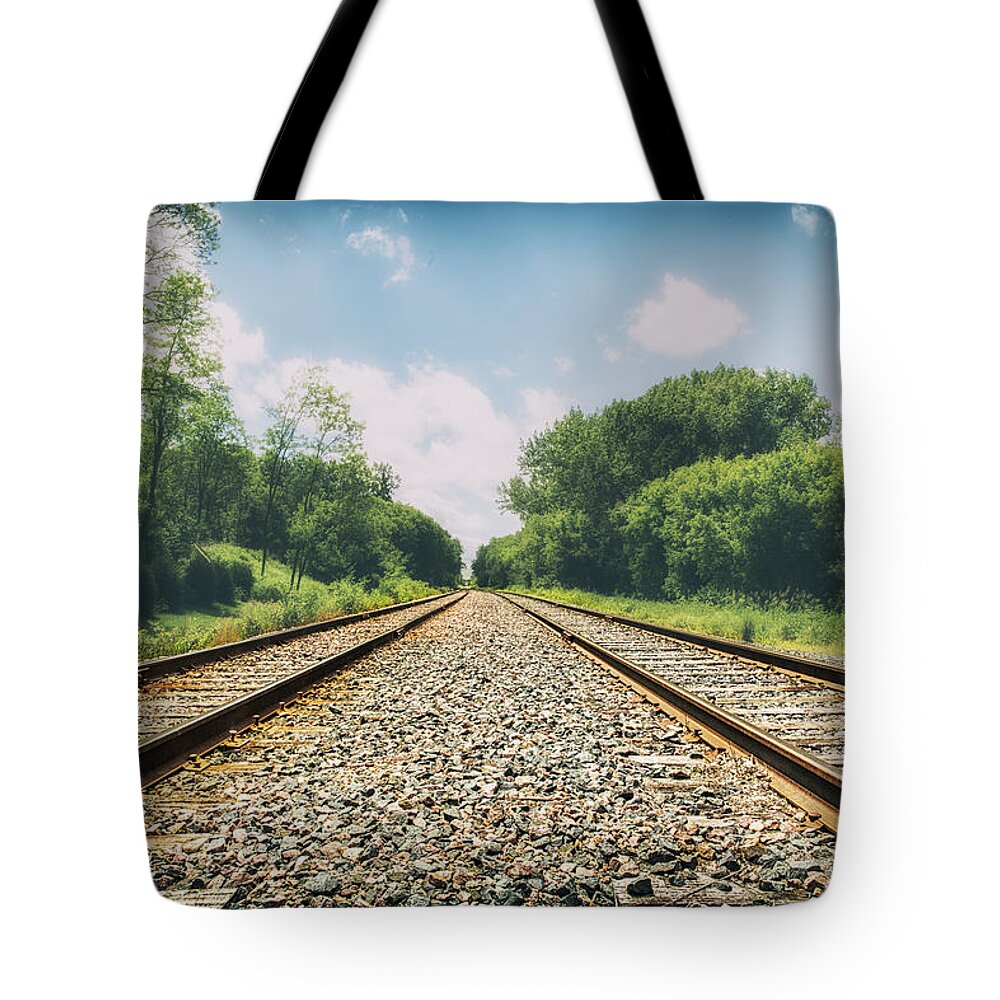 Train Tracks Tote Bag featuring the photograph Follow The Tracks by Bill and Linda Tiepelman