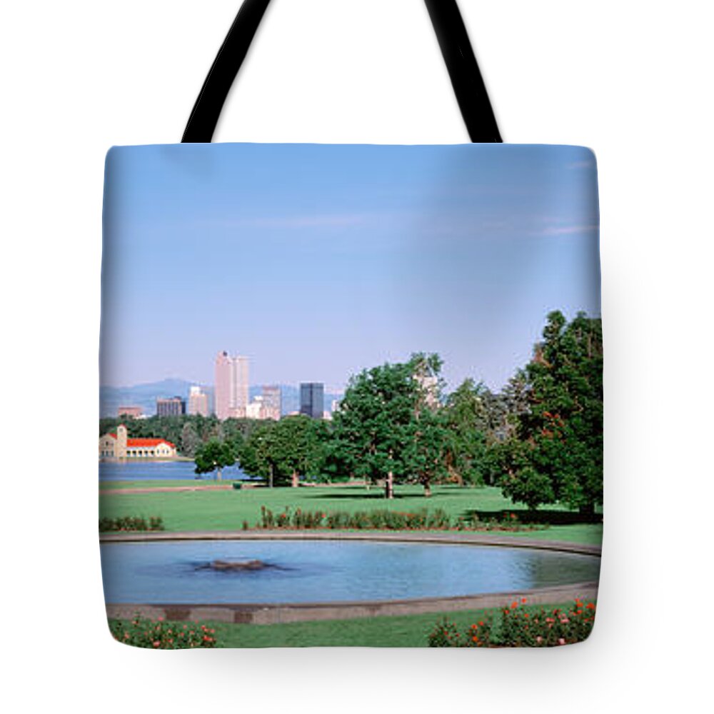 Photography Tote Bag featuring the photograph Formal Garden In City Park With City by Panoramic Images