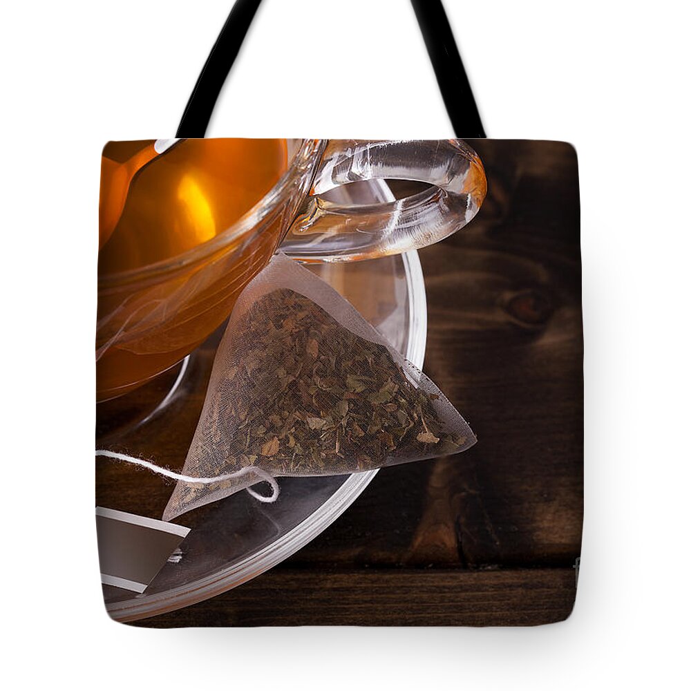 Tea Tote Bag featuring the photograph Fresh glass cup of tea by Simon Bratt