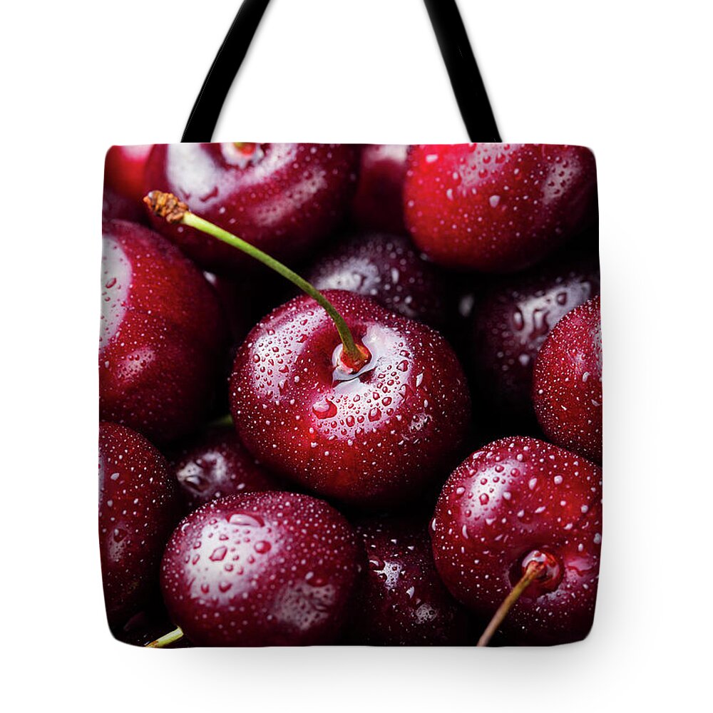 Cherry Tote Bag featuring the photograph Fresh Ripe Black Cherries Background by Anna Pustynnikova