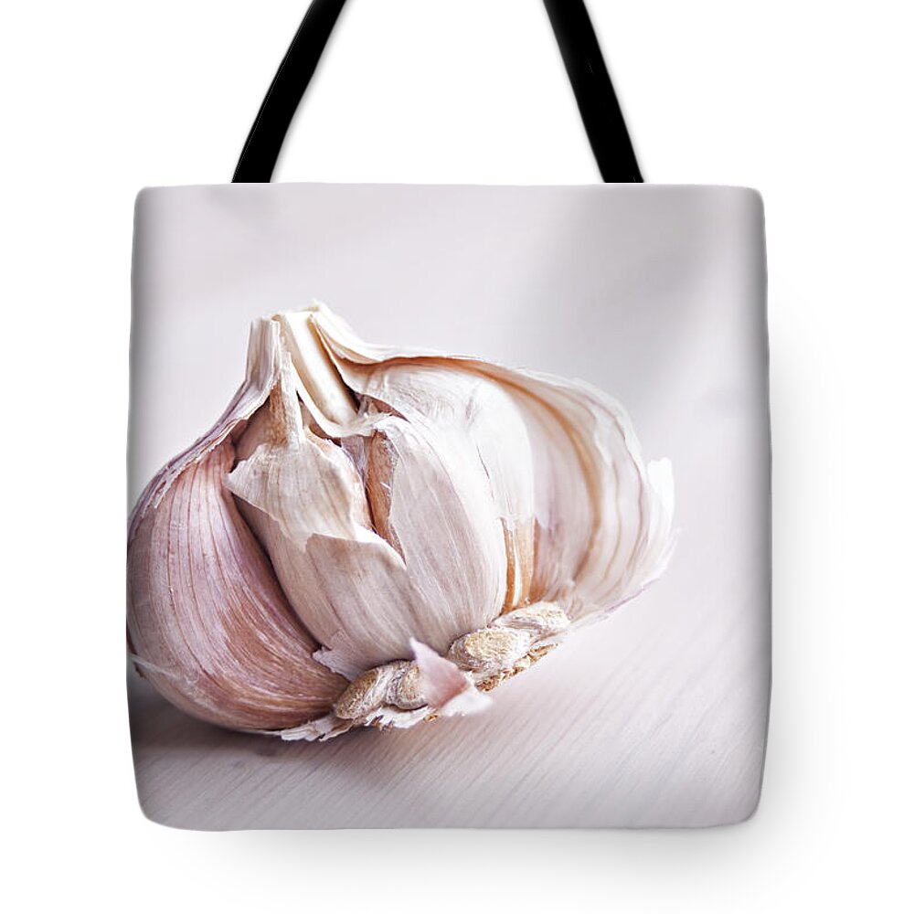 Vegetable Tote Bag featuring the photograph Garlic bulb by Sophie McAulay