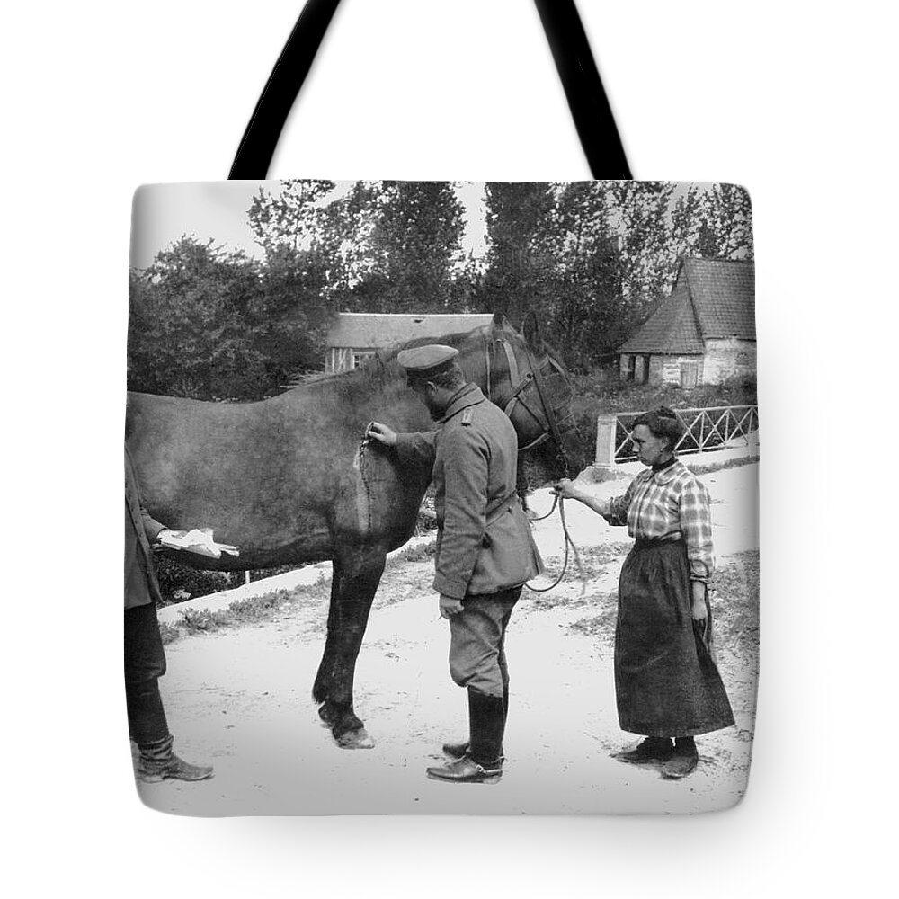 1910's Tote Bag featuring the photograph German Vet Treats French Horse by Underwood Archives