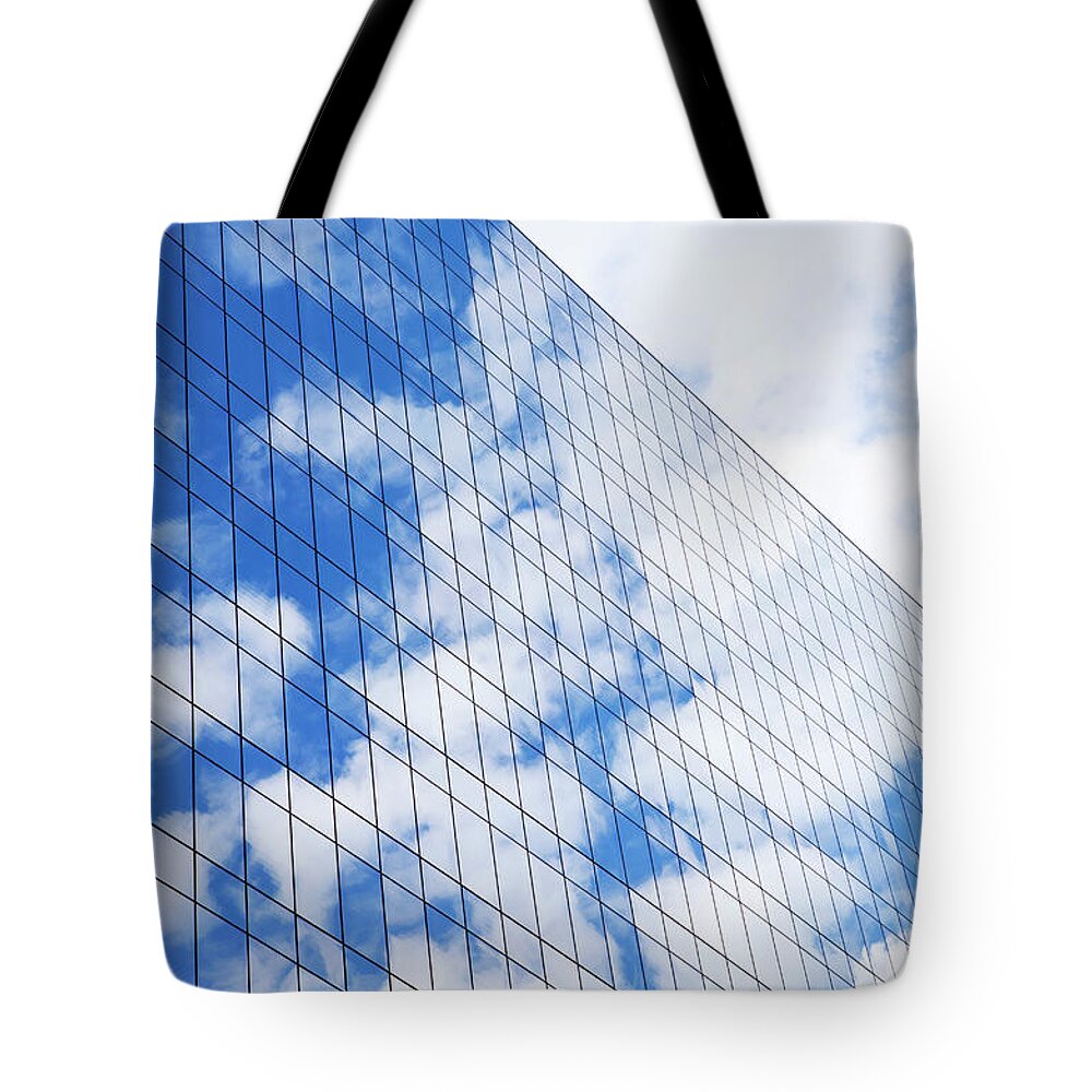 Downtown District Tote Bag featuring the photograph Glass Modern Building by Bluehill75