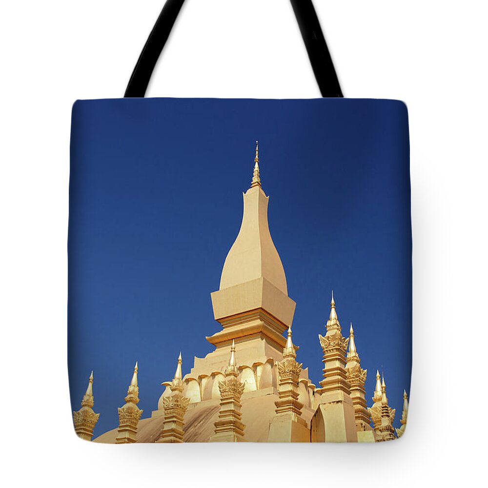 Built Structure Tote Bag featuring the photograph Gold Covered Buddhist Stupa,pha That by Miha Pavlin