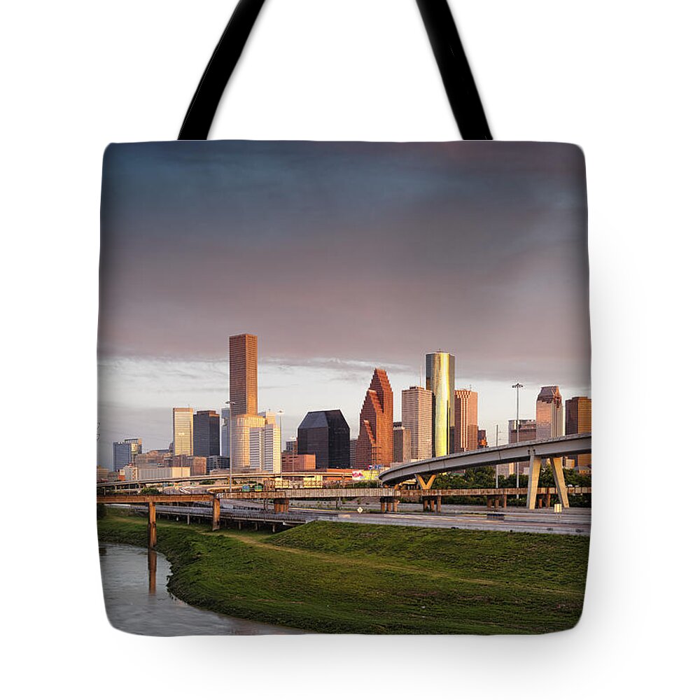 Golden Light Tote Bag featuring the photograph Golden Light on Downtown Houston by Silvio Ligutti