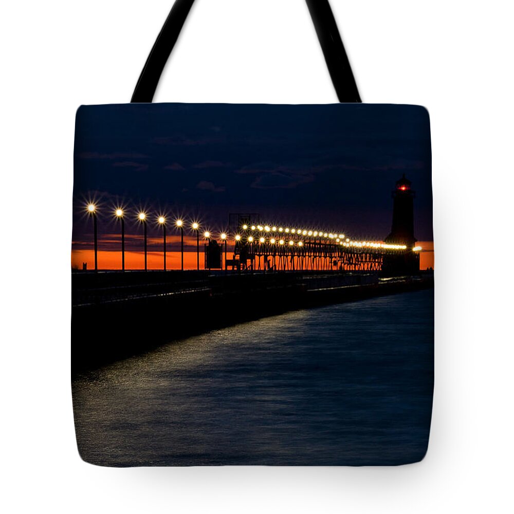 Grand Haven Lighthouse Tote Bag featuring the photograph Grand Haven Lighthouse by Lisa Chorny