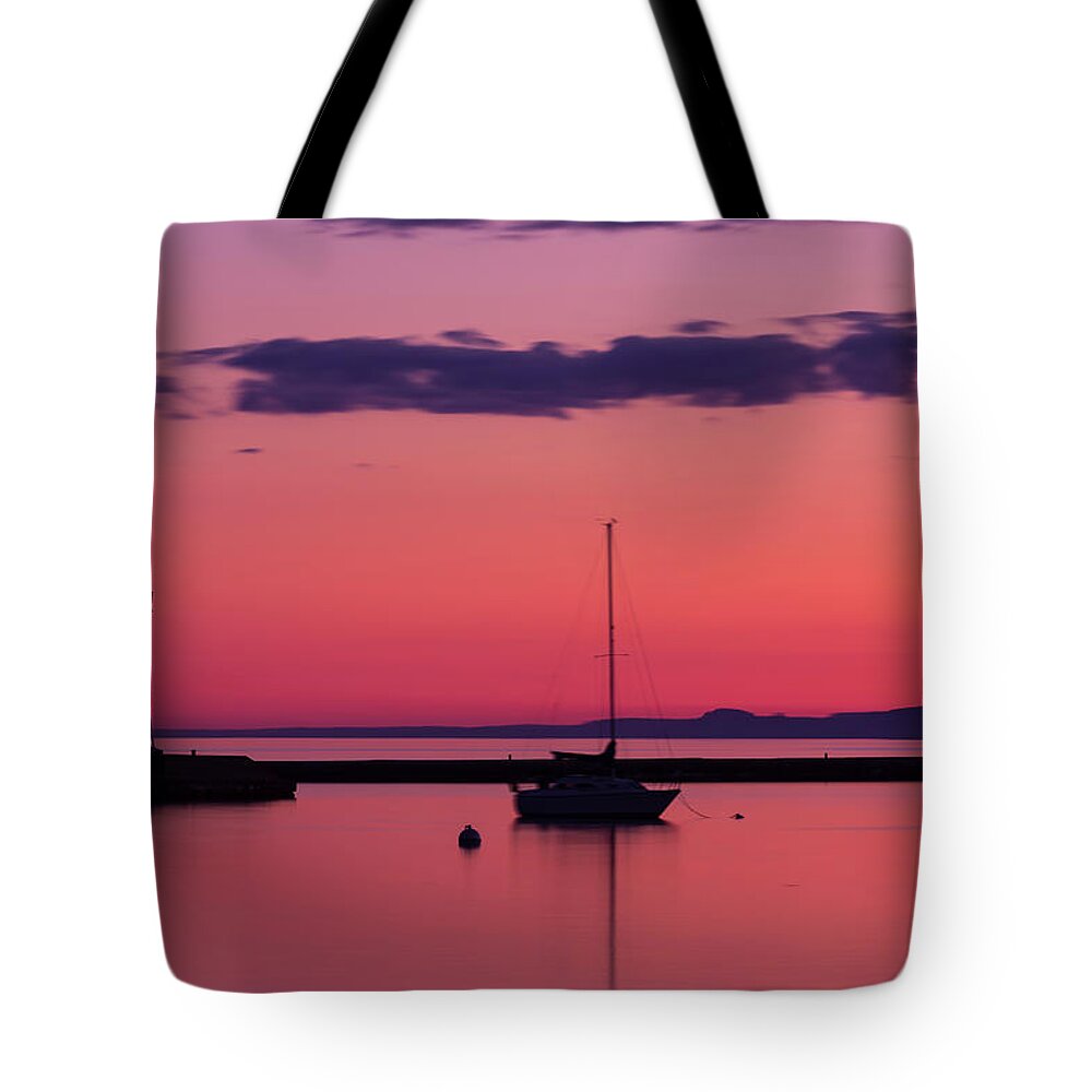 Water's Edge Tote Bag featuring the photograph Grand Marais Lighthouse by John brueske