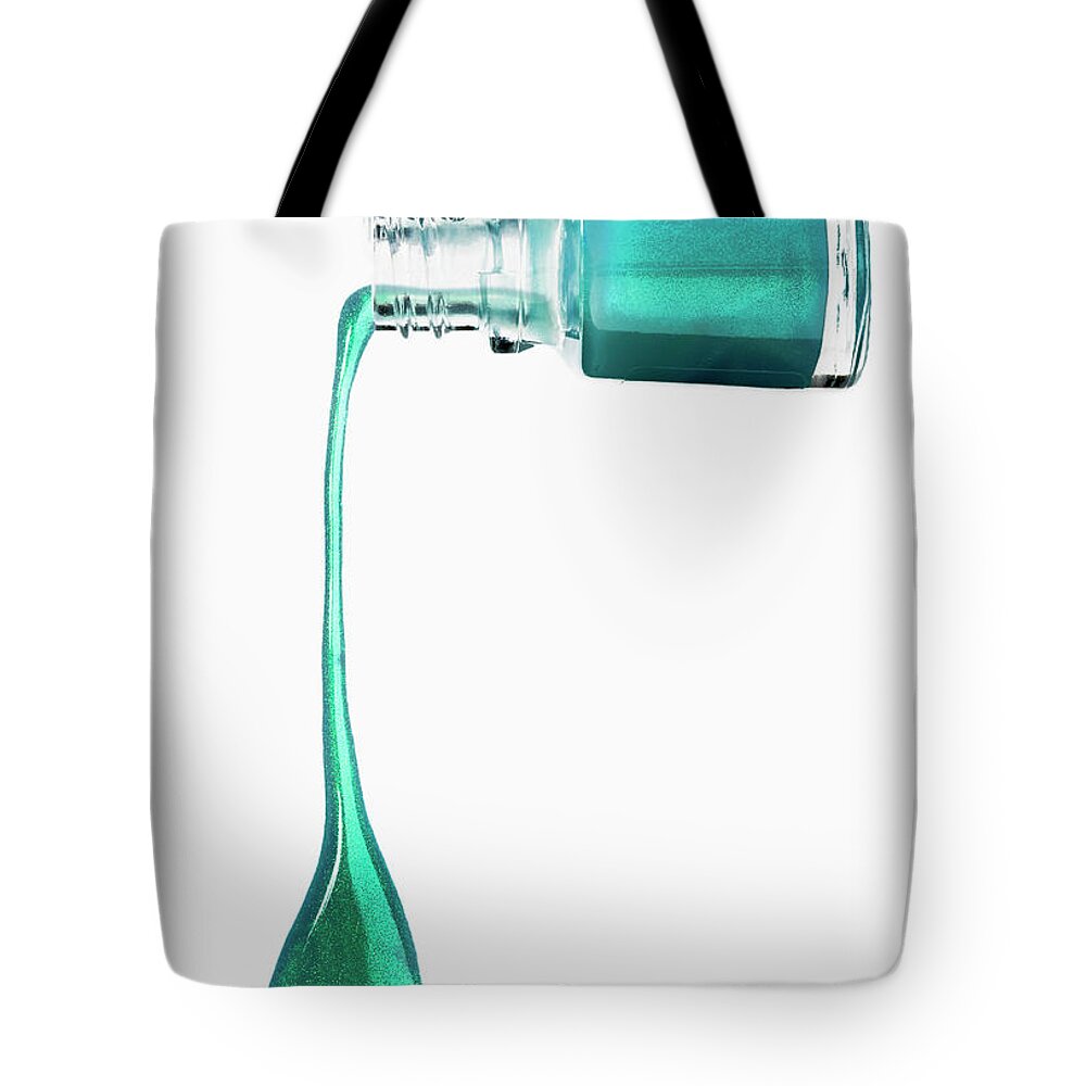 White Background Tote Bag featuring the photograph Green Nail Polish Dripping From A Bottle by Larry Washburn