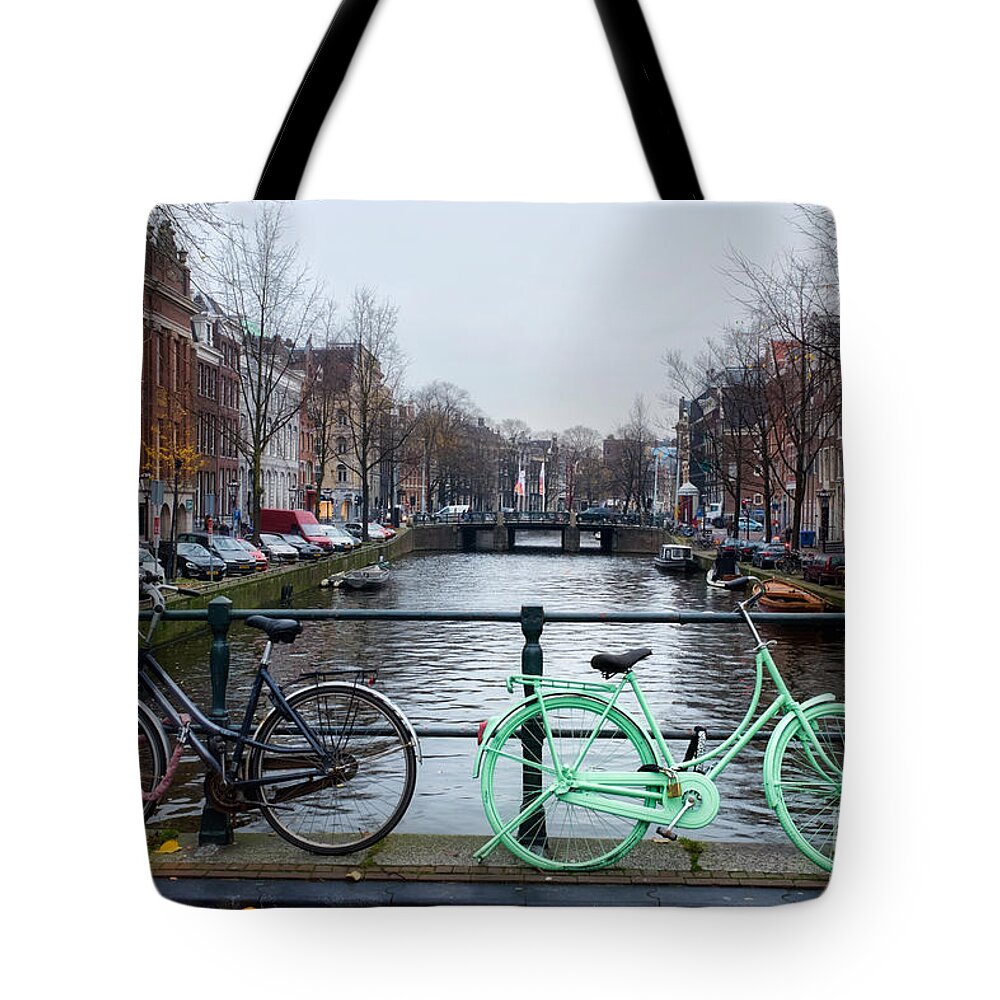 Amsterdam Tote Bag featuring the photograph Green Transport in Amsterdam by Ann Garrett