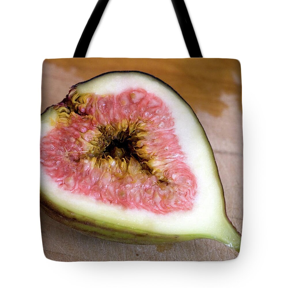 Close-up Tote Bag featuring the photograph Half A Fig On A Cutting Board by Rebecca E Marvil