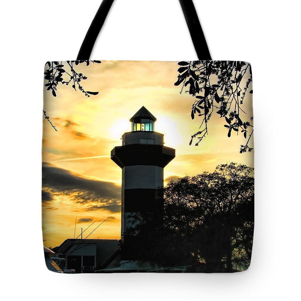 Lighthouse Tote Bag featuring the photograph Harbour Town Lighthouse Beacon by Dale Kauzlaric