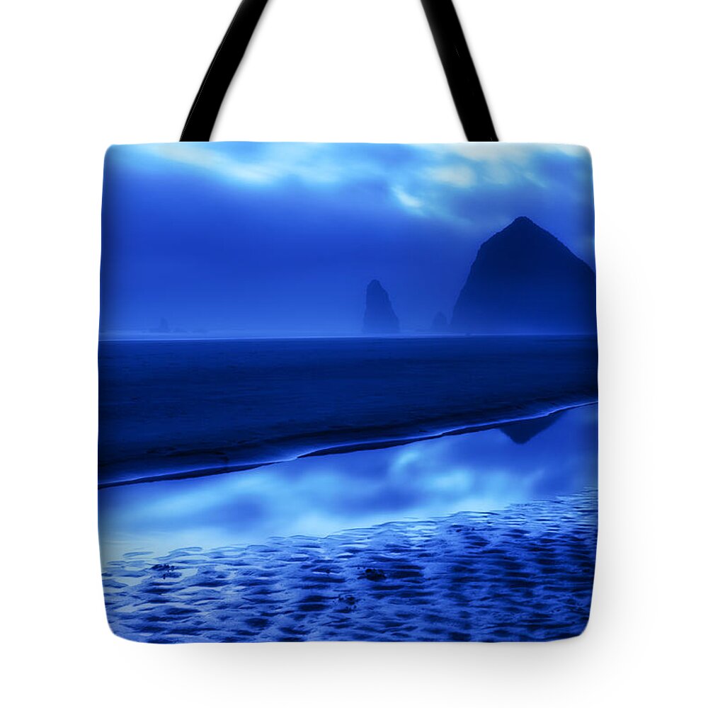 Haystack Rock Needles Cannon Beach Oregon Or Ocean Landscape Seascape Moody Blue Reflection Sand Fog Clouds Sunset Tote Bag featuring the photograph Haystack Blues by Patrick Campbell
