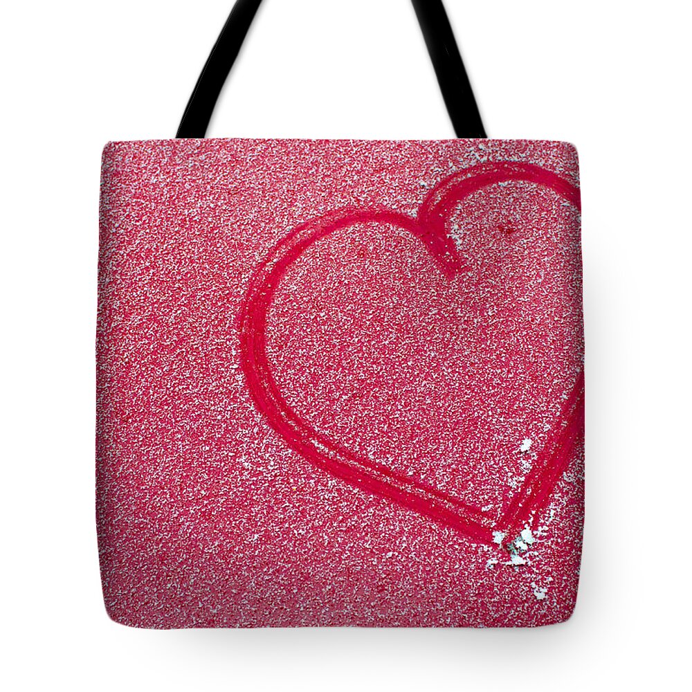 Heart Tote Bag featuring the photograph Heart In Snow by Andreas Berthold