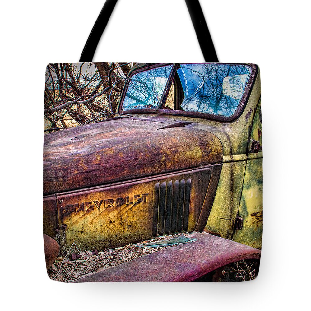 Steven Bateson Tote Bag featuring the photograph Hedge Row Chevy Truck by Steven Bateson