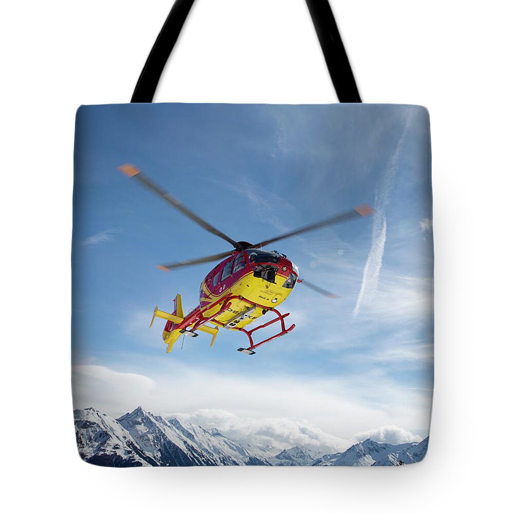 Snow Tote Bag featuring the photograph Helicopter In The Mountains by Chris Tobin