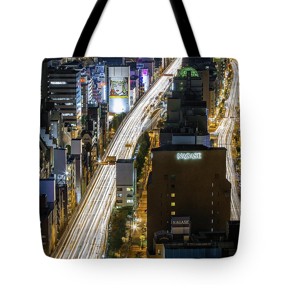 Osaka Prefecture Tote Bag featuring the photograph Highway At Night In Osaka With Traffic by Sandro Bisaro