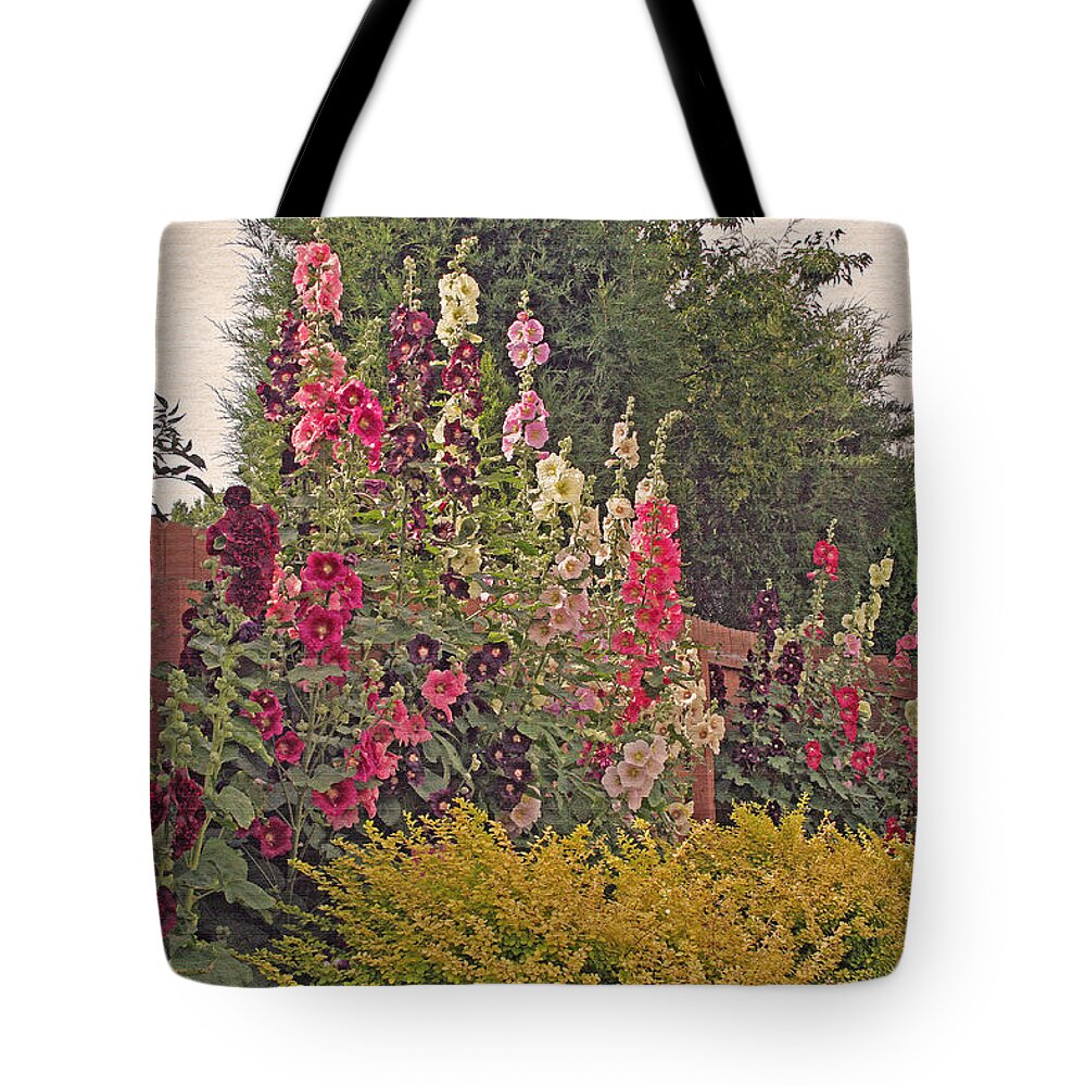 Hollyhocks Tote Bag featuring the photograph Hollyhocks by Kay Novy