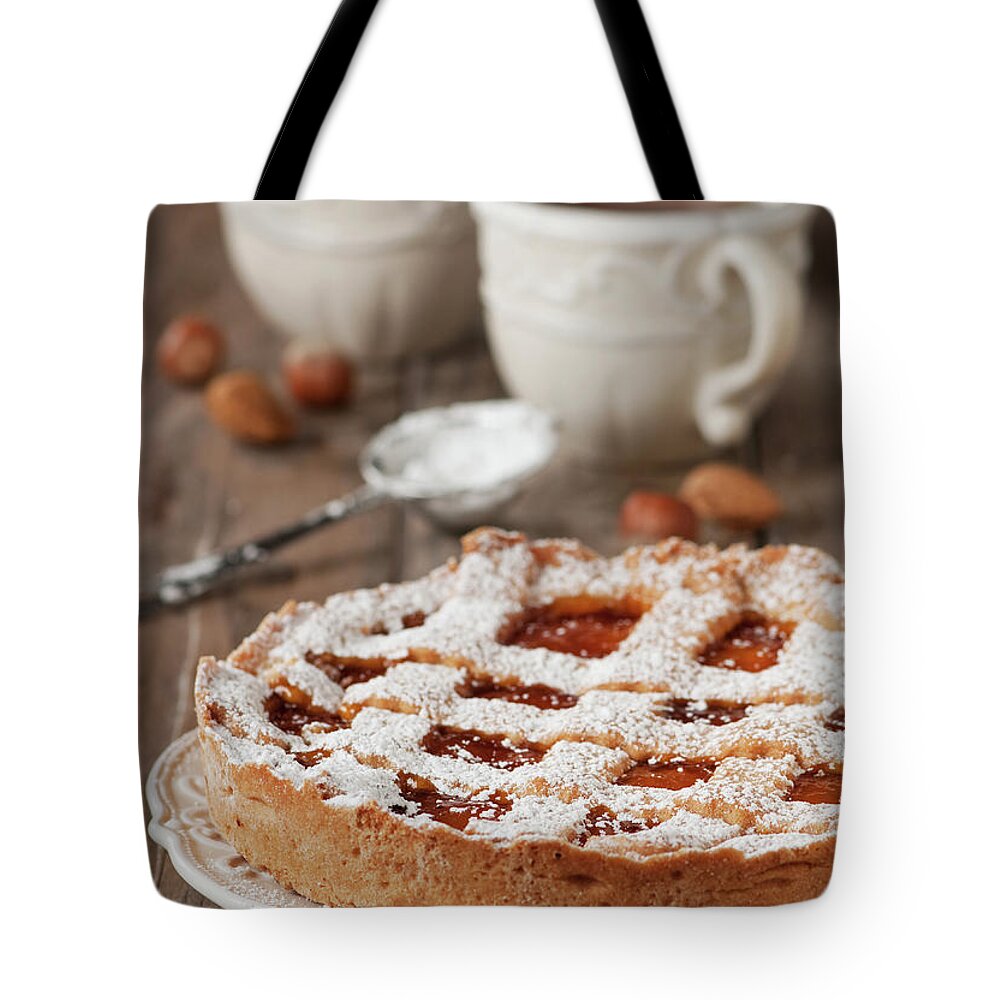 Spoon Tote Bag featuring the photograph Homemade Tart With Jam by Oxana Denezhkina