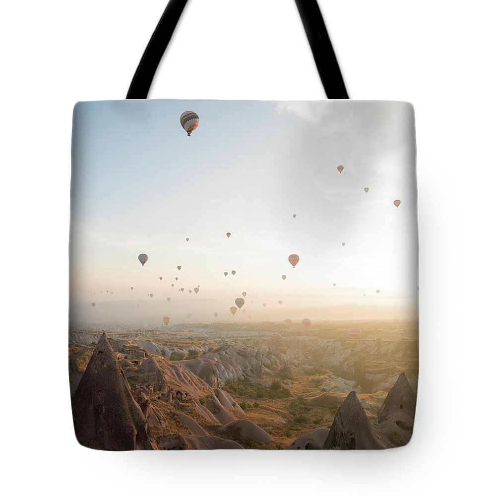 Scenics Tote Bag featuring the photograph Hot Air Balloons Rise Above Desert by Ascent Xmedia