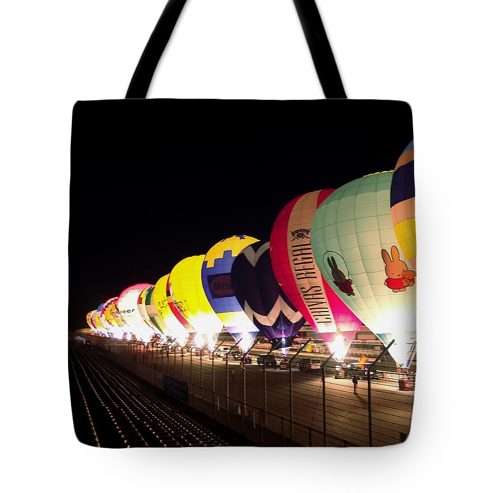 Balloon Air Hot Sky Flight Fly Sport Hot Air Balloon Basket Fun Colourful Blue Transport Ballon Travel Adventure Transportation Summer Freedom Ballooning Colorful Leisure Colours High Ride Recreation Color Bright Airship Flying Tote Bag featuring the photograph Balloon Glow by John Swartz