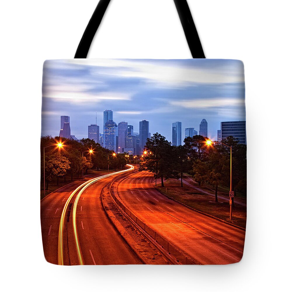 Scenics Tote Bag featuring the photograph Houston, Highway By Night And Skyline by Moreiso