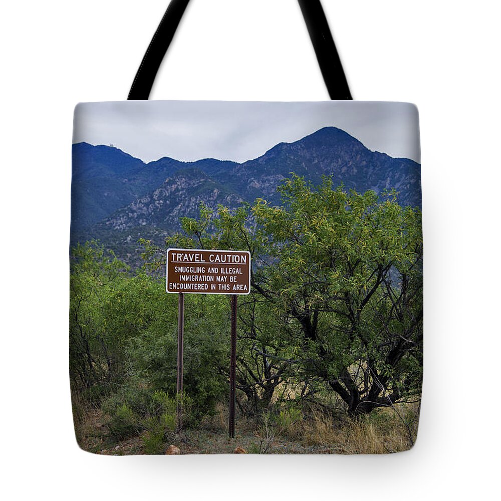 Nature Tote Bag featuring the photograph Human Smuggling And Illegal Immigration by Mark Newman