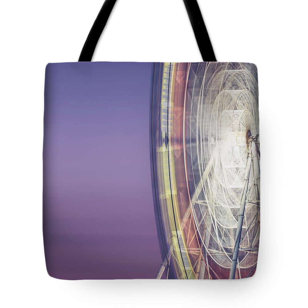 Scenics Tote Bag featuring the photograph Illuminated Motion Ferris Wheel At by Aaaaimages